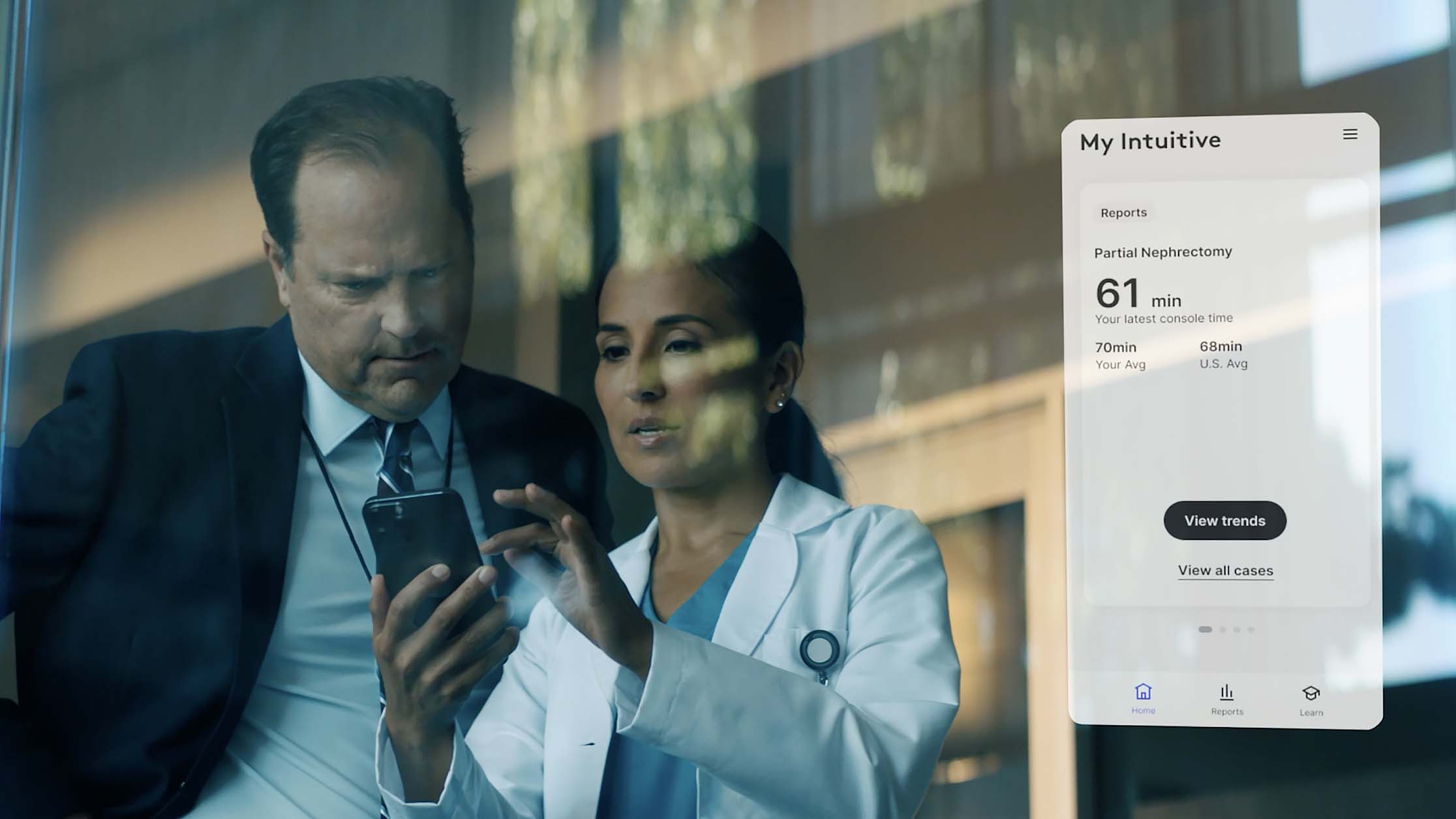 Doctor sharing a My Intuitive app screen on a mobile phone